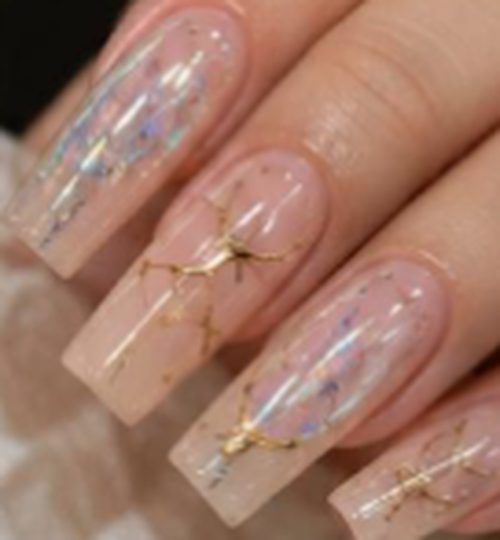 Clear nails with iridescent foil and gold accents